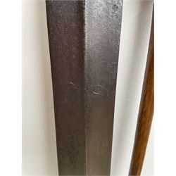 African Zulu assegai with short wooden haft L138cm and a Zulu stick carved with a head and dated 10/9/93 L87cm