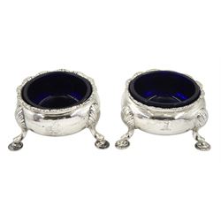 George II silver circular salt with beaded rim, blue glass liner and  hoof feet D6.5cm London 1746 and another made to match London 1894 Provenance: 3rd Earl of Feversham