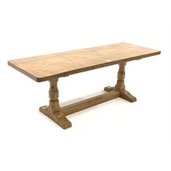 'Mouseman' Yorkshire oak oblong occasional table, with adzed top raised on octagonal turned supports, carved mouse signature, 122cm x 46cm, H45cm