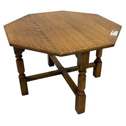 Early 20th century oak coffee table, octagonal top on turned supports united by X-stretchers