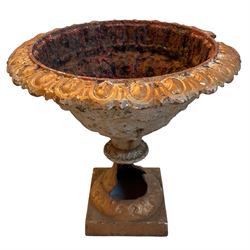Victorian cast iron garden urn, egg and dart moulded rim over floral decorated body, on skeletal circular footed base 