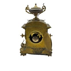French brass cased mantle clock c1880 with a domed pediment surmounted by a twin handled urn, rectangular case with finials to the sides over a spreading rectangular base raised on four recessed feet, with a one-piece white enamel dial contained within a beaded bezel and conforming spandrels to the corners, Roman numerals and steel moon hands, eight-day twin train rack striking movement stamped Japy Freres, striking the hours and half-hours on a bell.
With key and pendulum