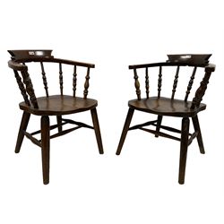 J Elliott & Son - pair early 20th century elm and beech Captains smokers bow chairs, spindle tub shaped back and saddle seat, raised on tapered supports united by double H stretcher