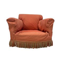 Early 20th century Howard design armchair, upholstered in neutral with sprung back and seat, hardwood frame, raised on square supports, the removable chair covering decorated with pink and green floral decoration, with second covering in deep coral with fringing
Provenance: property of a gentleman