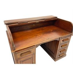 Late 19th century mahogany roll-top desk, tambour roll top over two panelled pedestals, fitted with two slides, four drawers and cupboard, plinth base
