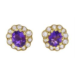 Pair of 18ct gold amethyst and diamond cluster stud earrings, hallmarked