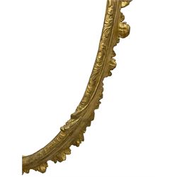 19th century giltwood and gesso wall mirror, the oval frame with c-scroll cartouche pediment decorated with foliage, foliate decorated frame terminating to c-scrolls