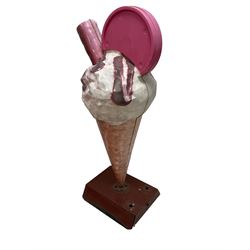 Large advertising shop display model of an ice cream, the waffle cone with vanilla scoop and chocolate sauce and flake, weighted base
