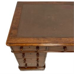 Victorian mahogany twin pedestal desk, moulded rectangular top with rounded corners and inset leather top, fitted with nine drawers, on skirted base