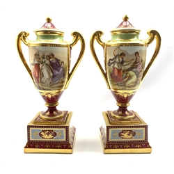 Pair of 'Vienna' two handled baluster vases with covers and stands decorated with classical figures on a maroon ground and titled to the bases 'Bachantinen' and 'Grazien'  H31cm with blue beehive mark
