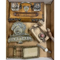 Prisoner of war ashtray inscribed 'P.O.W 1945', pair of belt buckle picture frames, desk stand, brass inkwell etc