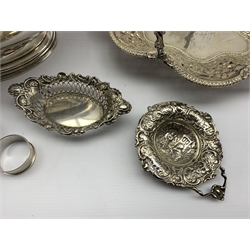 Edwardian chased and pierced silver strainer Chester 1902, silver sweetmeat dish Birmingham 1904, two silver serviette rings, Elkington plated oval tureen and a plated  cake dish 