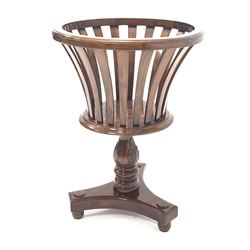 20th century mahogany circular jardiniere stand, raised on turned column and trefoil base with turned supports, D48cm