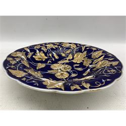 Meissen cobalt blue ground shaped bowl, decorated in relief with gilt heightened foliage, crossed swords mark in underglaze blue beneath and impressed 188, D29cm