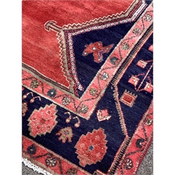 Persian Hamadan red ground rug, with four lozenge medallions enclosed by stylised foliate to border, 305cm x 148cm