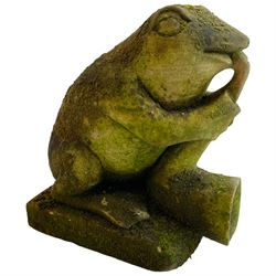 Weathered stone figure of a frog playing the saxophone, on rectangular plinth base