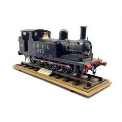  Scale model of L.N.E.R. 0-6-0 locomotive, Class J71 No. 453 with painted livery constructed by N Downing 1985 Model No. 110 on display track with makers plaque L54cm   