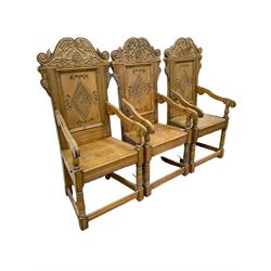 Set six 17th century style oak Wainscot chairs, the shaped pediment relief carve with stylised plant motifs and scrolls, panelled back carved with lozenge, moulded plank seat, on turned supports joined by stretchers with incised decoration 