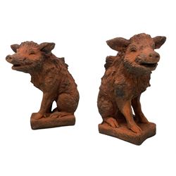 Pair of terracotta finish composite stone garden figures in the form of wild boars 
