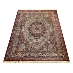 Keshan super carpet, with a centre floral medallion, overall floral design on beige field and borders  