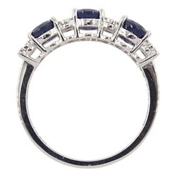 White gold three stone round sapphire and eight round brilliant cut diamond ring, stamped 9K, total sapphire weight approx 2.00 carat
