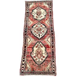 Vintage Persian runner rug, ivory triple medallion on red field with geometric decoration, enclosed by guarded border 277cm x 107cm