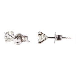 Pair of 18ct white gold round brilliant cut diamond stud earrings, stamped 750, total diamond weight approx 1.00 carat