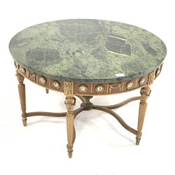  French style circular marble top coffee table, with porcelain roundel depicting courting couples, and gilt metal mounts, raised on turned reeded supports, D85cm  