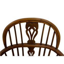 19th century elm and yew Windsor chair, low hoop stick back with pierced splat, dished seat raised on ring turned supports joined by crinoline stretcher