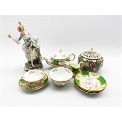 Early 20th century German porcelain figure of a figure of a woman protecting a nest of chicks from a cat, Mintons Green Cockatrice pattern tea wares, comprising teapot, tea cup, four saucers, sugar bowl and milk jug, together with a 19th/ early 20th century Canton jar, with matching pierced cover 
