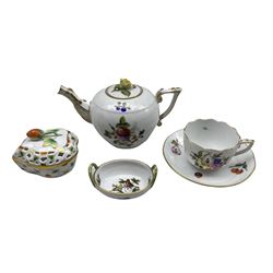 Herend bullet shape teapot decorated with flowers and with bud lift, Herend cup and saucer with fruit and flowers, Herend limited edition box and cover 266/500 and a small two handled dish