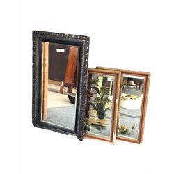 Pair of hand painted mirrors with bevel edge in gilt frame, together with a late 19th century ebonised carved wood and gesso framed mirror 