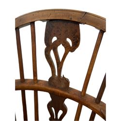 19th century low back Windsor chair, the yew wood spindle and splat back over elm seat, raised on turned supports 