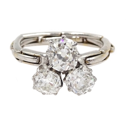 Early 20th century platinum three stone old cut diamond ring, on later 17ct white gold expanding shank, total diamond weight approx 1.35 carat