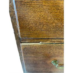 19th century oak chest on chest, the projecting cornice over two short and five long drawers, raised on bracket supports 