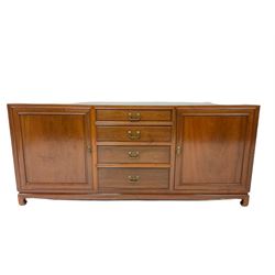 Chinese rosewood sideboard, the rectangular top over four graduated drawers, flanked by two cupboards, raised on square supports W183cm, H80cm, D36cm 