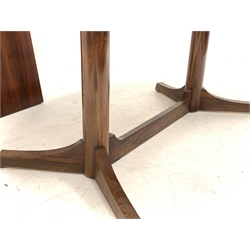 Mid 20th century hardwood veneer extending dining table, the oval top raised on two turned pedestals and splayed supports, with one additional leaf, H72cm, 110cm x 200 - 246cm (extended)