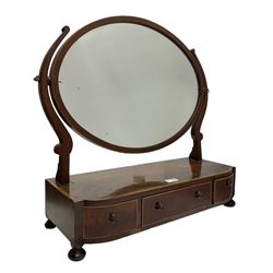 George III mahogany toilet mirror, oval swing mirror over three drawers, with satinwood banding, on turned bun feet
