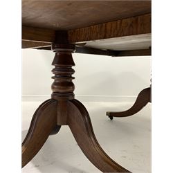 Regency period mahogany twin pillar dining table, the rectangular top with rounded corners and moulded edge raised on two collar turned supports over triple splay supports terminating in brass cup castors 196cm x 138cm, H74cm