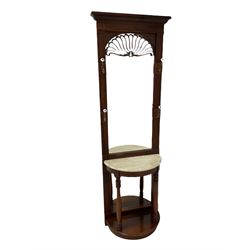 Victorian style hallstand, the projecting dental cornice and one mirror, flaked by four hooks for hanging over demi lune shelf with marble top supported by two turned columns flanking mirror over an under-tier, raised on a plinth base H203cm