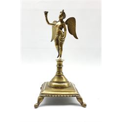 18th/19th Continental bronze candlestick in the form of a winged female figure on a square base and shaped supports H28cm