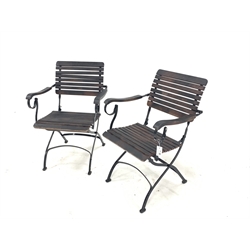 Pair of stained slatted hardwood and wrought metal folding garden chairs 