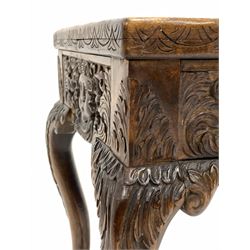 20th century carved mahogany lamp table, the moulded lunette carved top with inset bevelled glass plate over floral and mask carved frieze, raised on cabriole supports 50cm x 36cm, H49cm
