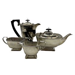 Silver 4 piece tea set of bead edge oblong design, the teapot and hot water jug with ebonised handles and lifts Sheffield 1936 Makers mark BRS 52oz