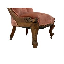 William IV walnut framed nursing chair, scrolled cresting rail with acanthus leaf decoration, upholstered in buttoned pale pink fabric with sprung seat, raised on cabriole supports with applied scrolling, brass and ceramic castors