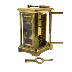 A late 19th century French Corniche cased 8-day timepiece carriage clock with a jewelled lever platform escapement, overcoil balance with timing screws, white enamel dial with Roman numerals and minute markers, steel spade hands, bevelled glass panels to the case and a rectangular glass panel to the top of the case, dial and movement inscribed “Made in France”.    With key.                  