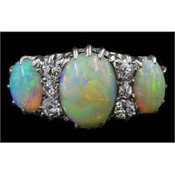 Early 20th century 18ct white gold three stone opal and six stone old cut diamond ring, in velvet and silk lined leather box 
