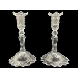 Pair of 19th century cut glass candlesticks, both having removable nozzles, faceted sconces above a baluster stem, on domed cut feet, H23cm 