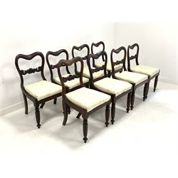 Set eight Regency rosewood dining chairs, with shaped cresting rail and scroll carved back rail over cream damask upholstered drop in seat pads, raised on turned front supports 