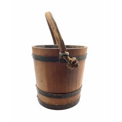 Early 20th century coopered oak fire bucket with rope twist and leather clad handle, H31cm 
